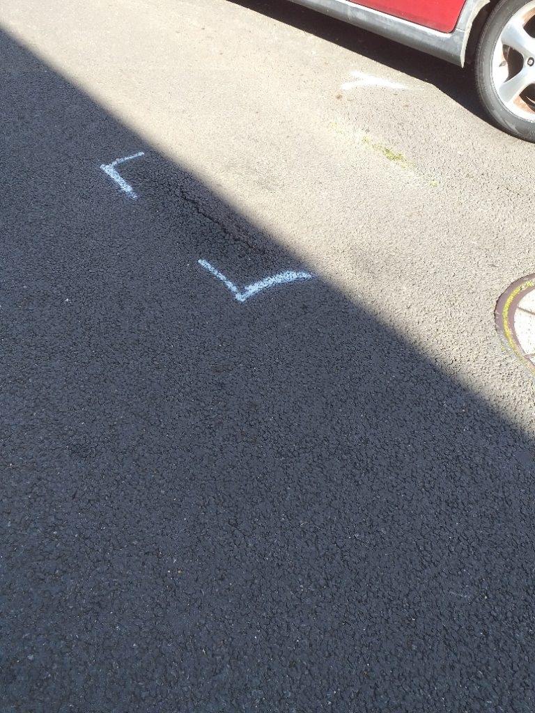 Marked up road defect in Heytesbury Road