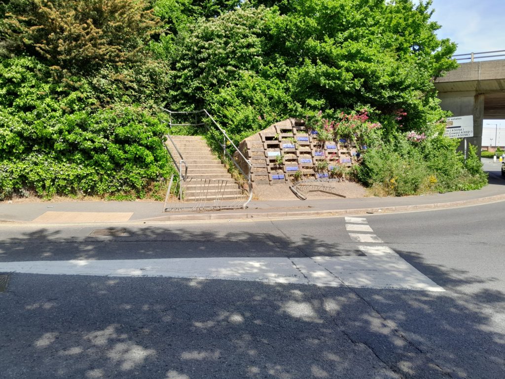 Damaged railings visible at bottom of steps through to Hookes Way