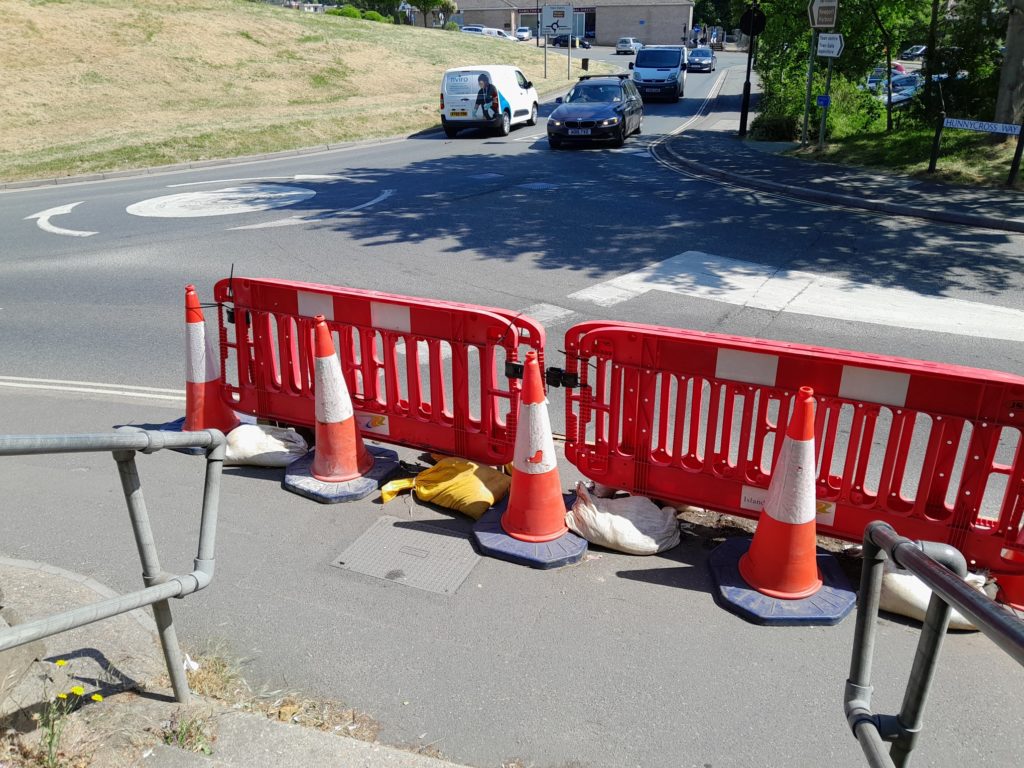 Temporary barriers in place at bottom of steps to Hookes Way